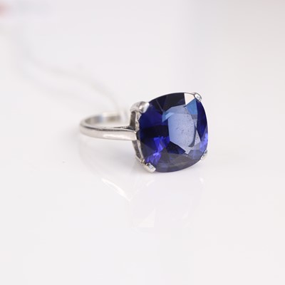 Lot 300 - A white metal synthetic sapphire set solitaire...