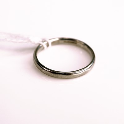 Lot 302 - A platinum court shaped wedding band, sponsor...