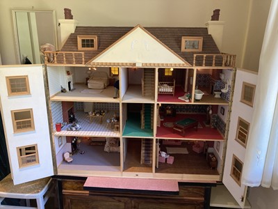 Lot 151 - A 20th century painted wooden dollhouse,...