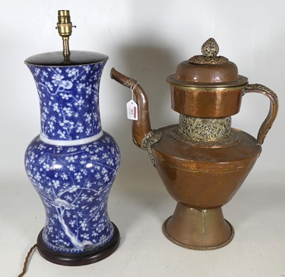 Lot 163 - A Tibetan copper teapot of large proportions,...