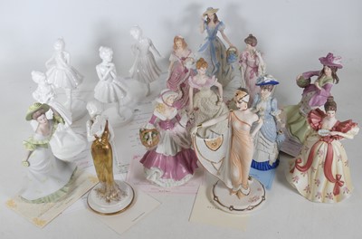 Lot 167 - A collection of porcelain figures of ladies,...