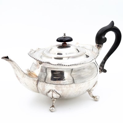 Lot 98 - A George V silver teapot, of oval bombe form...