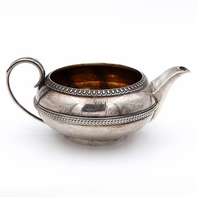 Lot 82 - A George III silver teapot (lacking cover), of...