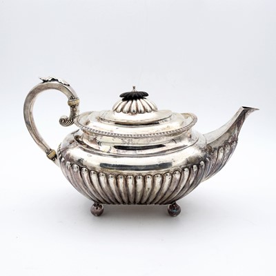 Lot 96 - A Victorian silver teapot, of half reeded oval...