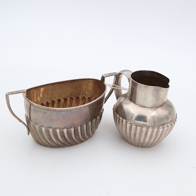 Lot 242 - A Victorian tea duo, comprising cream jug and...