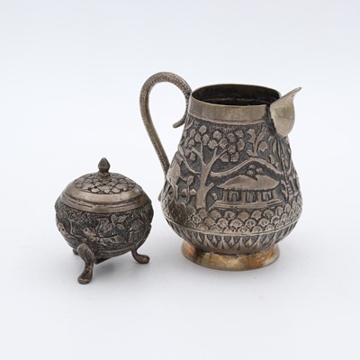 Lot 259 - A late 19th century Indian white metal cream...