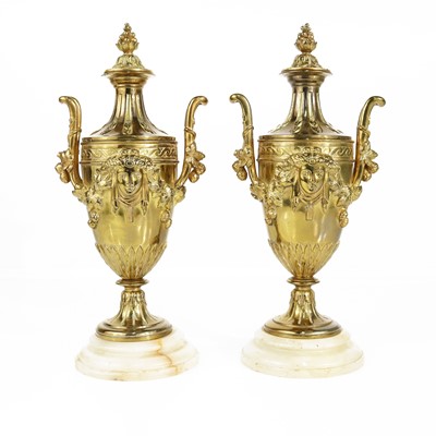 Lot 127 - A pair of neo-classical gilt brass pedestal...