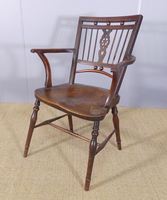 Lot 250 - A 19th century elm seat and fruitwood...