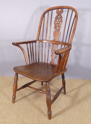Lot 259 - A 19th century elm seat and yew wood Windsor...