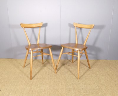 Lot 469 - A pair of Ercol blond elm and beech bar back...