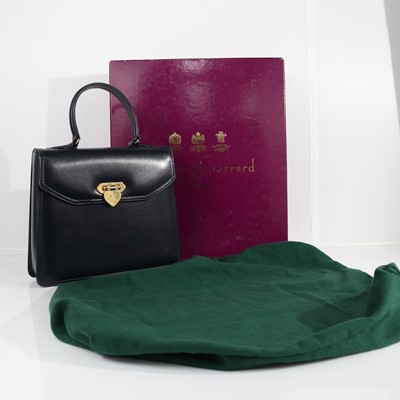 Lot 402 - Asprey & Garrard, a navy leather handbag,...