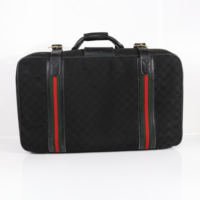 Lot 399 - Gucci, a black GG monogram canvas suitcase,...