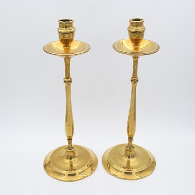Lot 7 - A pair of brass table candlesticks, each...