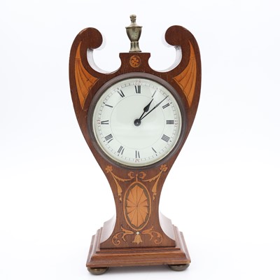 Lot 23 - An Edwardian stylised balloon shaped mantel...