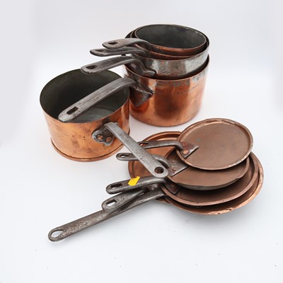Lot 43 - Five copper saucepans, each having a riveted...