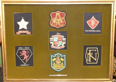 Lot 530 - A collection of South African woven badges...