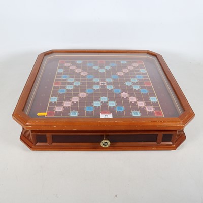 Lot 60 - A collector's edition Scrabble board, with...