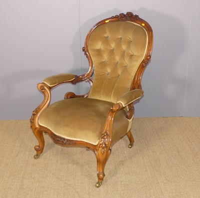 Lot 680 - A mid-Victorian walnut floral carved showframe...