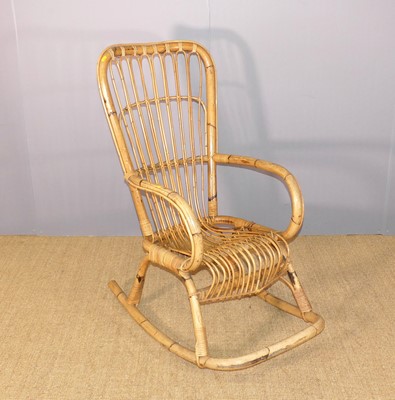 Lot 686 - A bamboo rocking elbow chair, w.58cm