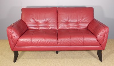 Lot 688 - A contemporary rouge leather upholstered...