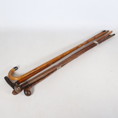 Lot 72 - A collection of walking sticks, to include a...