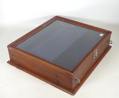 Lot 76 - A stained pine glazed table top display case,...
