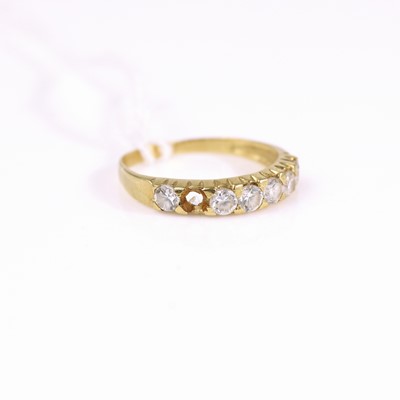 Lot 309 - A yellow metal CZ set half eternity ring (one...