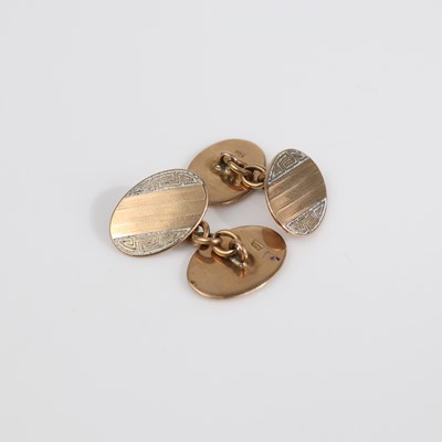 Lot 327 - A pair of 9ct gold engine turned gent's oval...