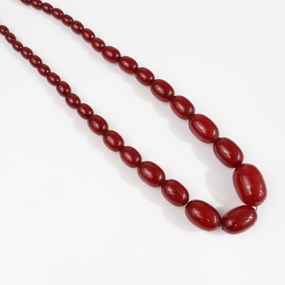 Lot 331 - A beaded cherry amber necklace arranged as 43...