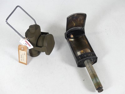 Lot 93 - A World War II period green painted metal lamp,...