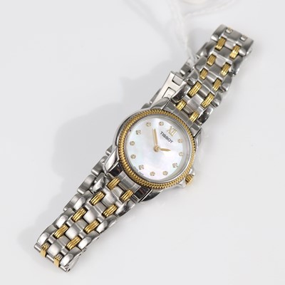 Lot 345 - A lady's Tissot steel cased and gold plated...