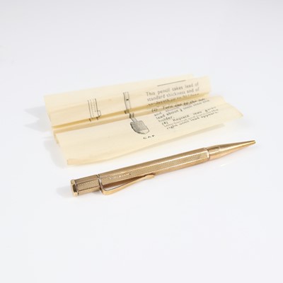 Lot 351 - A 9ct gold propelling pencil having engine...