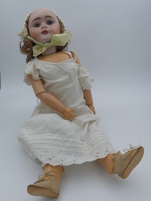Lot 129 - An early 20th century German bisque-head doll,...
