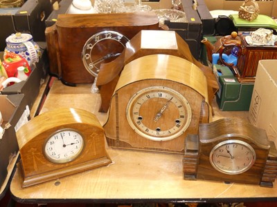 Lot 138 - An Art Deco figured walnut cased mantel clock,...