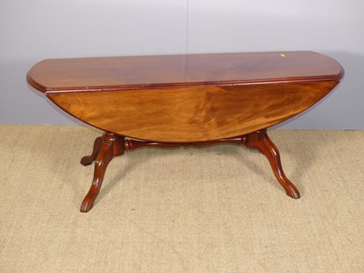 Lot 704 - A contemporary mahogany drop-flap coffee table,...