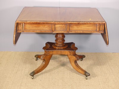 Lot 707 - A George IV mahogany drop flap two-drawer sofa...