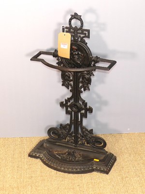 Lot 709 - A cast iron stickstand, decorated with cherub...