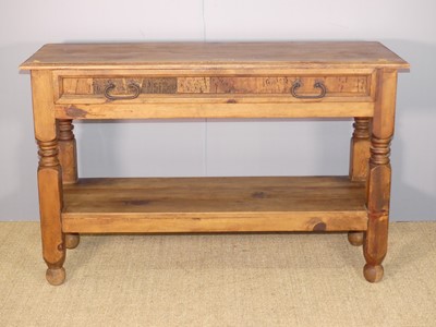 Lot 720 - An Eastern stained pine two-tier side table,...