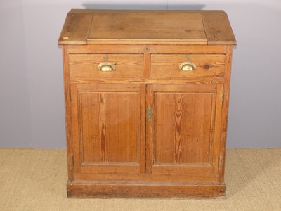 Lot 721 - A pitch pine slopefront clerk's desk, the...
