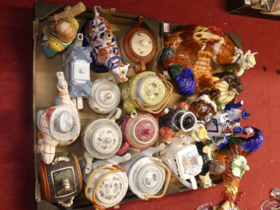 Lot 161 - A collection of novelty teapots, to include an...
