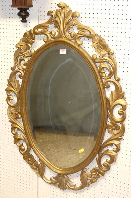 Lot 595 - A floral gilt wood carved and pierced oval...