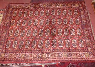 Lot 746 - A Persian woollen red ground Bokhara rug,...