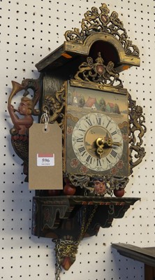 Lot 596 - A Swiss painted wood and pierced brass...