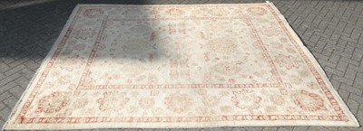 Lot 750 - A large Persian woollen red and cream ground...