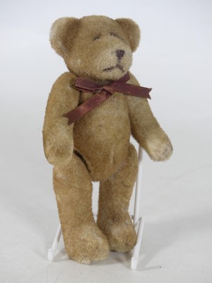 Lot 209 - A 20th century weighted felt teddy bear, with...