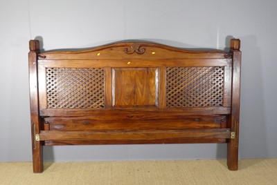 Lot 603 - A contemporary Indonesian stained teak and...
