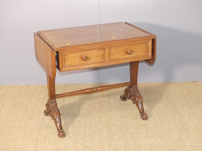 Lot 605 - A small hardwood low two-drawer drop flap...