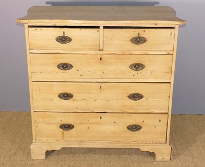 Lot 621 - A rustic pine serpentine-topped chest of two...