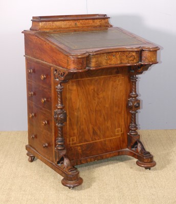 Lot 622 - A mid-Victorian figured walnut slope front...