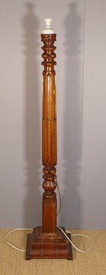 Lot 629 - A mahogany stop-fluted pedestal standard lamp...